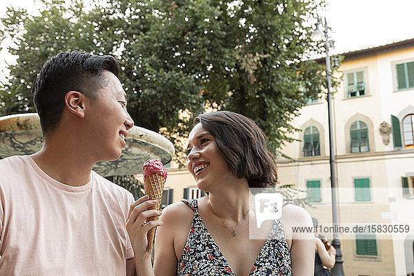 Happy couple enjoying Gelato in Florence Italy