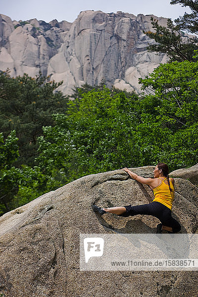 Female climber bouldering at Seroksan national park in South Korea