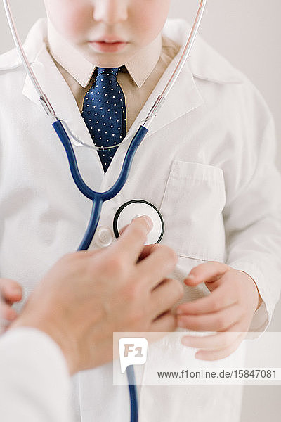 Child in labcoat with stethoscope