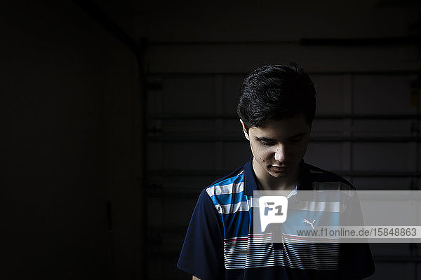 Portrait of a Teen Boy Looking Down