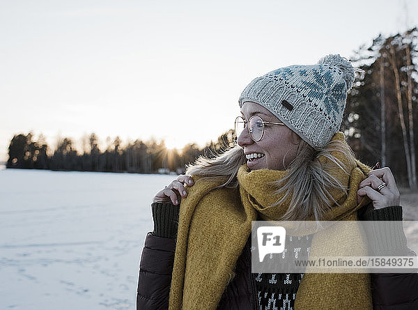 portrait of a woman wrapped up warm whilst walking in Sweden