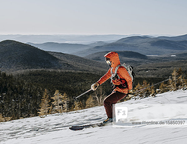 Skier speeds down slope on Baldface Mountain  New Hampshire