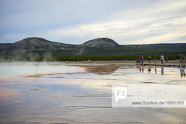 Tourists view Grand Prismatic Spring from the boardwalk