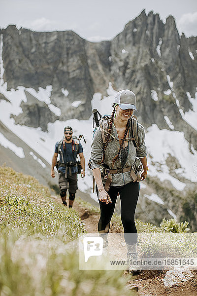 A couple hike together in the Cascade mountains  washington