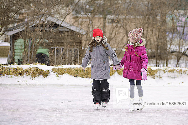 Two Girls Ice Skating