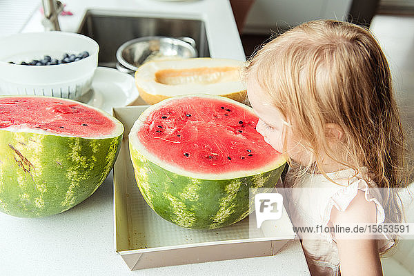 Little girl eating a watermelon