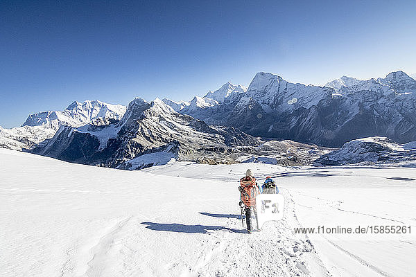 Woman mountaineer & climbing sirdar descend Mera Peak  Everest in view