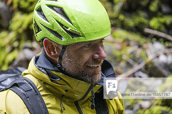 Portrait of happy man wearing climbing helmet.