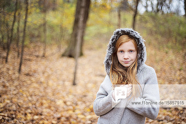 Young Red Hair Girl in sweater Outside in Fall.