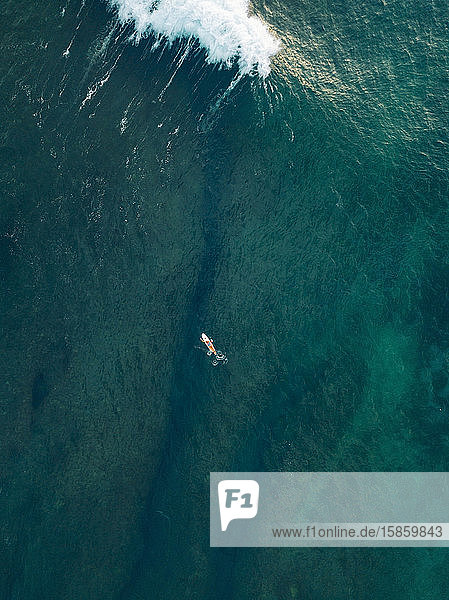 Aerial view of surfer in the ocean