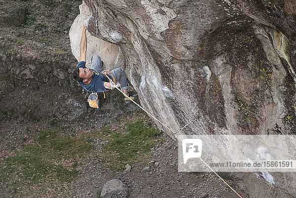 One man holding a rope while rock climbing in Jilotepec  Mexico