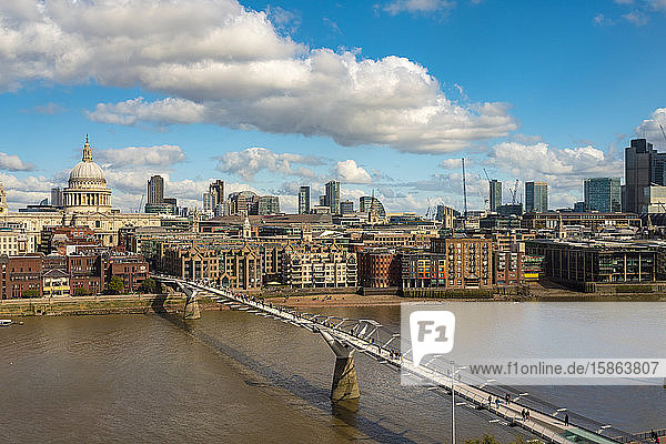 skyline of the city of london with St Paul and the millenium Bridge