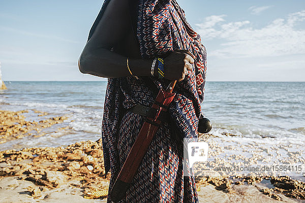 Close up of Maasai warrior with a traditional knife attached to a belt