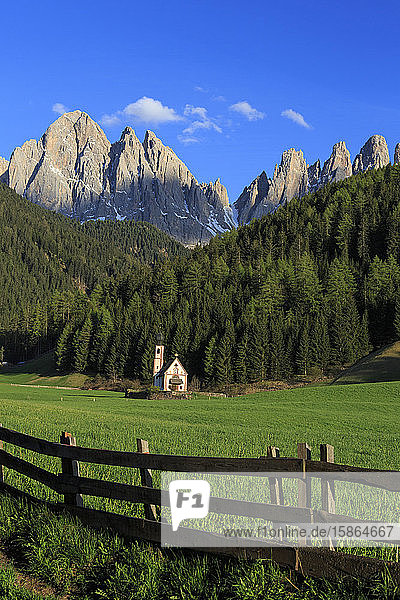 The Church of Ranui and the Odle group in the background St. Magdalena Funes Valley Dolomites South Tyrol Italy Europe