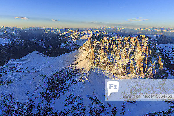 Aerial view of Sassolungo Sassopiatto and Grohmann peaks at sunset Sella Group Dolomites Trentino-Alto Adige Italy Europe