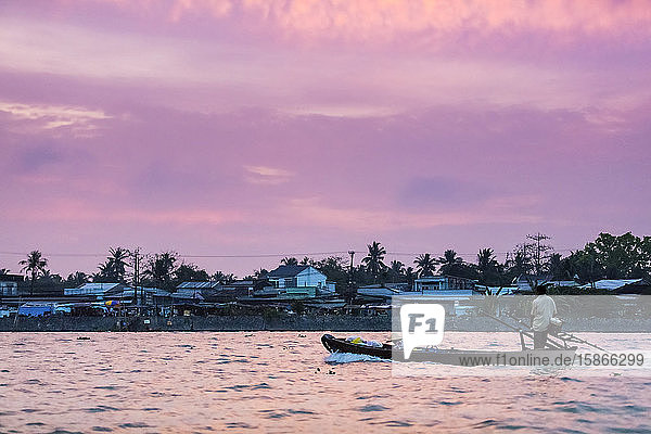 Cai Rang Floating Market in the Hau River at dusk Mekong Delta; Can Tho Vietnam