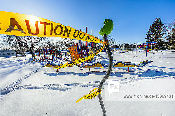 A playground cordoned off with caution tape during the COVID-19 World Pandemic; Edmonton Alberta Canada