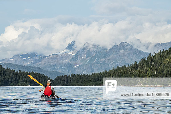 Kayaker paddling in Prince William Sound; Alaska  United States of America