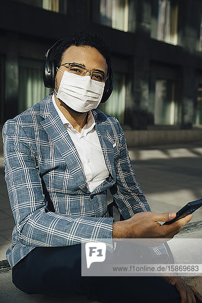 Portrait of businessman with face mask