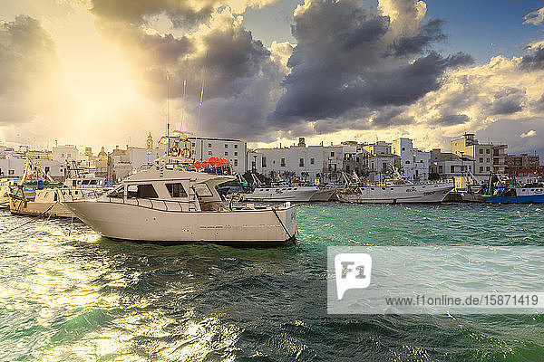 Cloudy sunset in the port of Monopoli Apulia Italy Europe