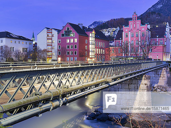 Pedestrian bridge cross the Inn river during twilight Innsbruck Tyrol Austria Europe