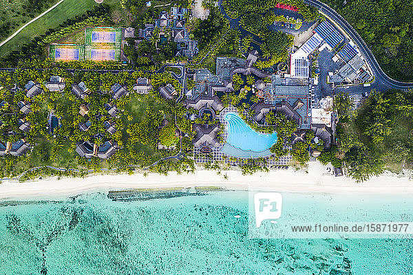Aerial view by drone of luxury tourist resort on palm-fringed beach facing the tropical lagoon Le Morne Brabant Mauritius Indian Ocean Africa