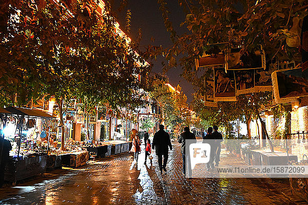 People walking in the main street at night  Old Kashgar  Xinjiang  China  Asia