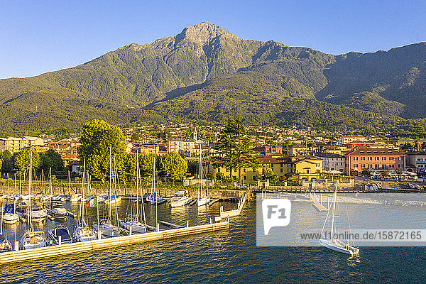 Sailing boat arrived at the port of Colico village Lake Como Lombardy Italian Lakes Italy Europe