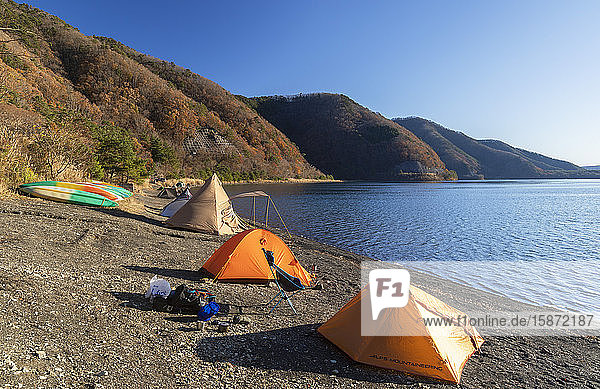 People camping next to Lake Motosu, Yamanashi Prefecture, Honshu, Japan, Asia
