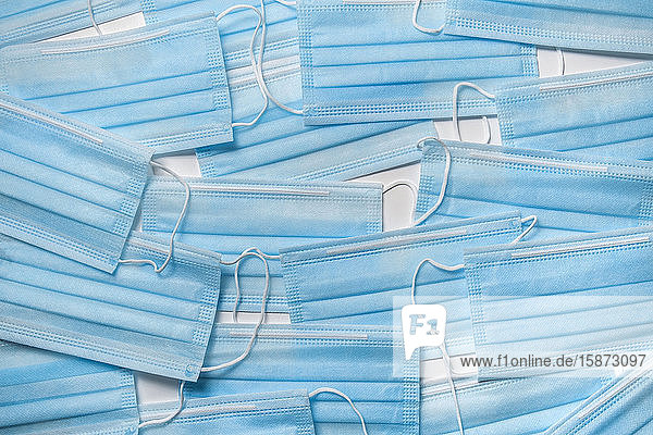 Blue medical masks on white background