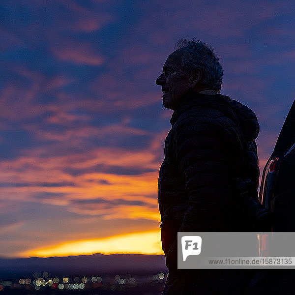 Silhouette of senior man at sunset