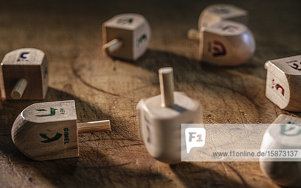 Dreidels on wooden table