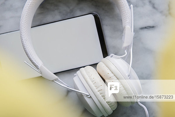 White headphones and smart phone