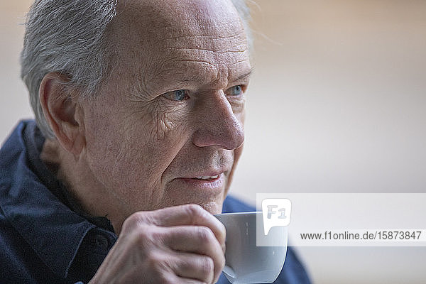 Senior man with coffee cup