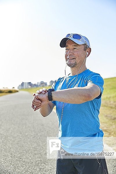 Mature Japanese man training downtown