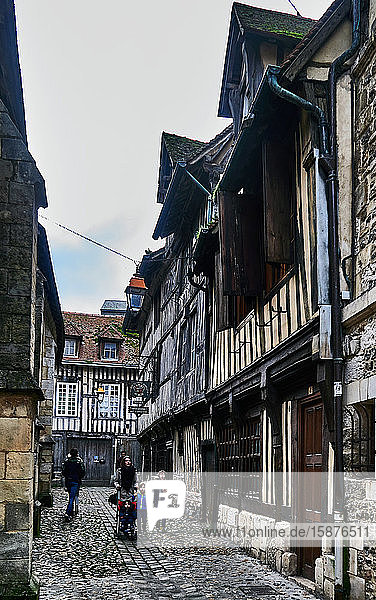 People in the cobble streets Small butchers ( rue des Petits Boucherie ) of old town Honfleur.