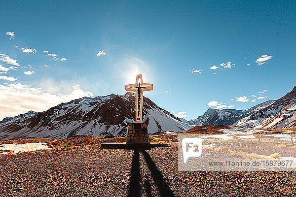 View of cross with mountains