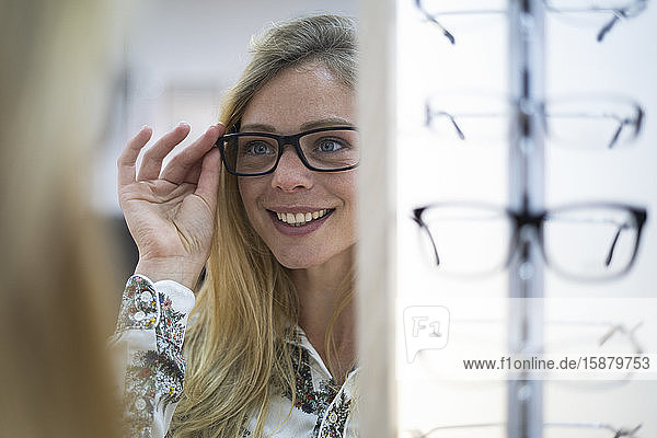 Young woman wearing eyeglasses in store