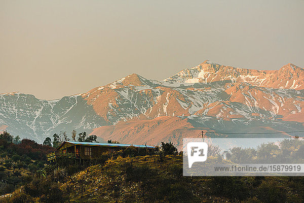 View of mountains with house in foreground