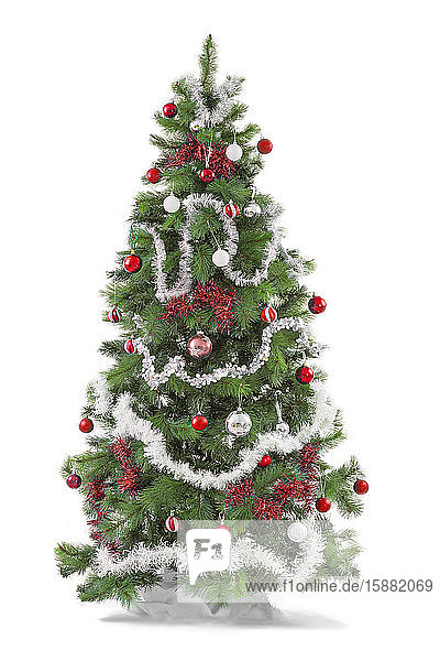 Red and white Decorated christmas tree  isolated on white