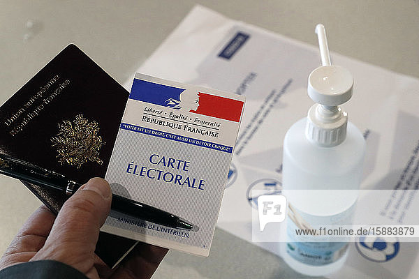 Polling station during the coronavirus epidemic ( COVID-19). Ballot and hydroalcoholic gel. Saint Gervais. France.