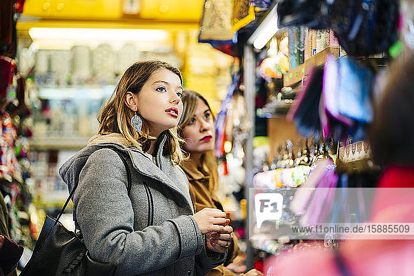 Two young women shopping in a store