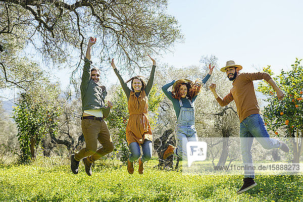 Group of friends jumping in the countryside