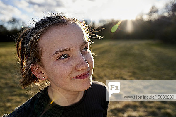Portrait of smiling girl on a meadow