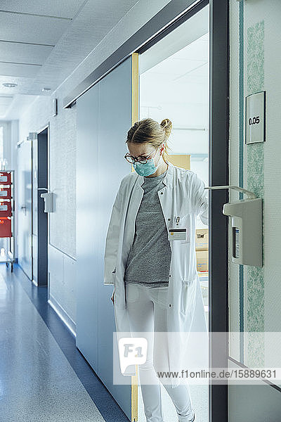 Doctor standing on hospital hallway