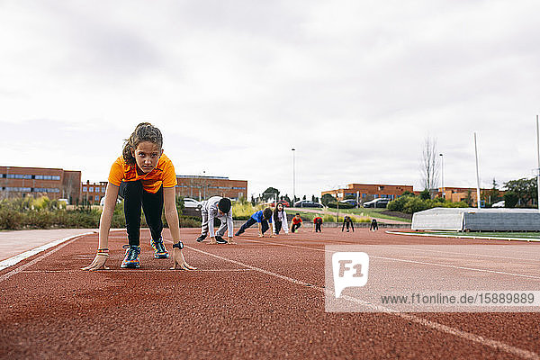 Children in starting postion preparing for a race