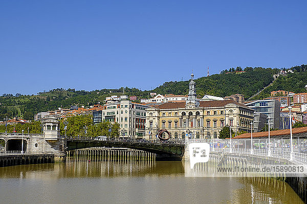 Spain  Biscay  Bilbao  Clear blue sky over arch bridge across Nervion river canal