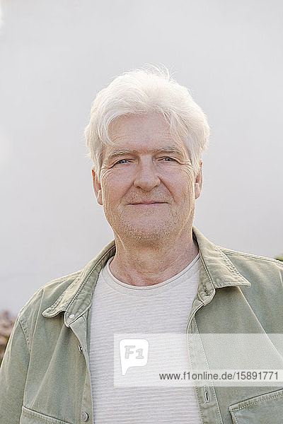 Portrait of confident senior man outdoors