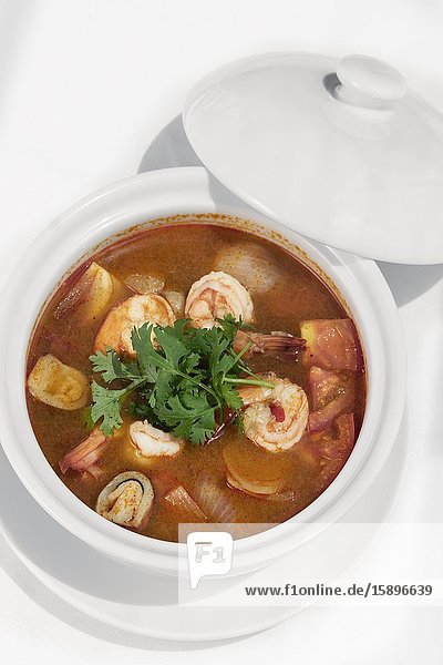 Thai tom yum kung spicy and sour shrimp soup on white table background in phuket thailand.