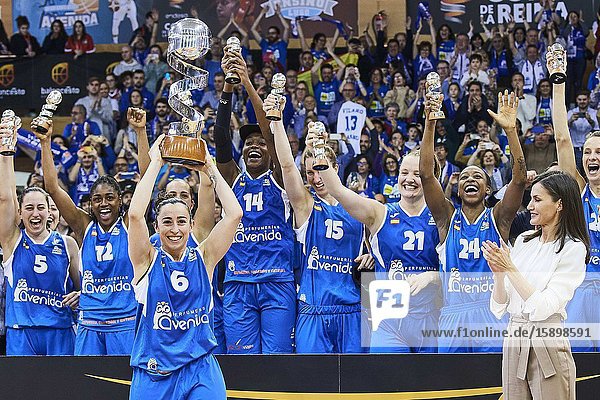 Queen Letizia of Spain hands Silvia Dominguez of Perfumerias Avenida the Queen Cup trophy during ‘Spanish Queen's Cup’ Basket Final match between Perfumerias Avenida (winner) and Uni Girona at Pabellon Multiusos Sanchez Paraiso on March 8 2020 in Salamanca Spain